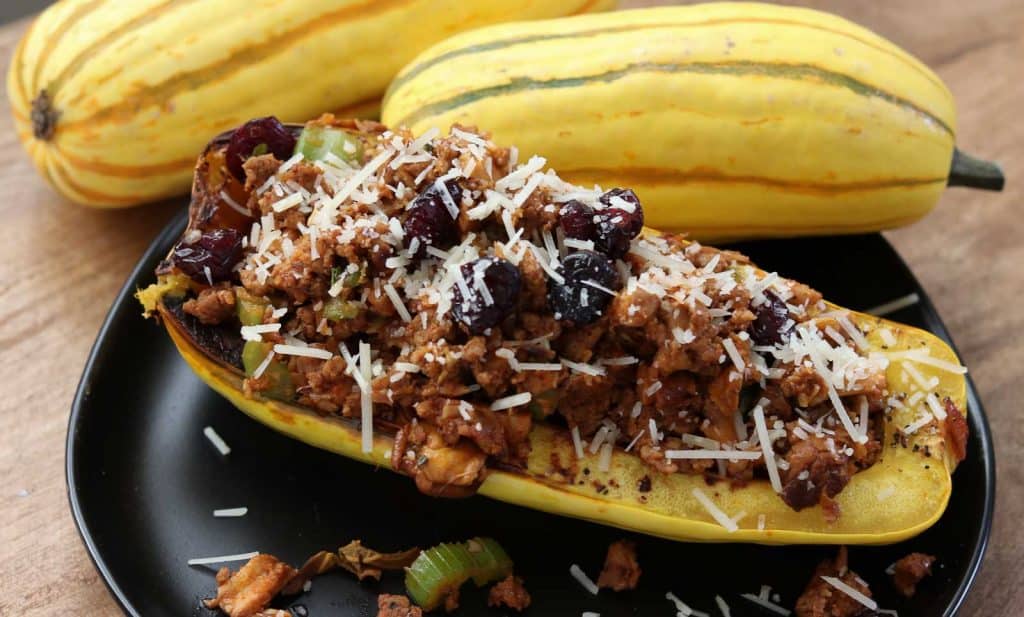 Healthy Stuffed Delicata Squash with Spicy Chicken Sausage and Cranberries from Gourmet Done Skinny