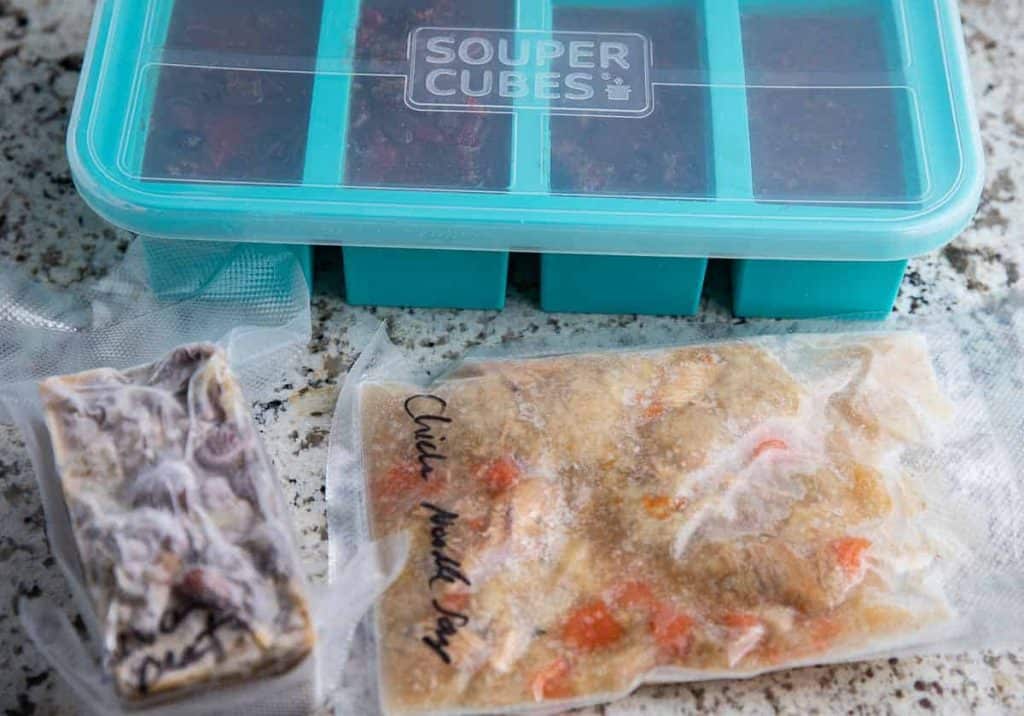souper cube with lid, 2 vacuum sealed bags with soup